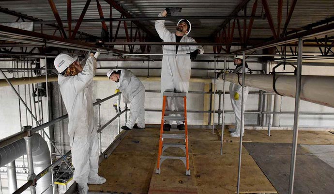 Professional team reconstructing commercial property