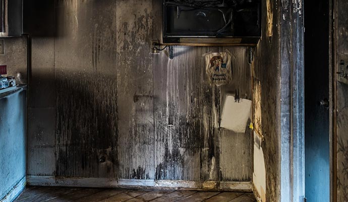 Smoke and soot damaged wall