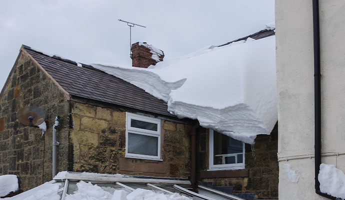 Ice damaged residential house gutter